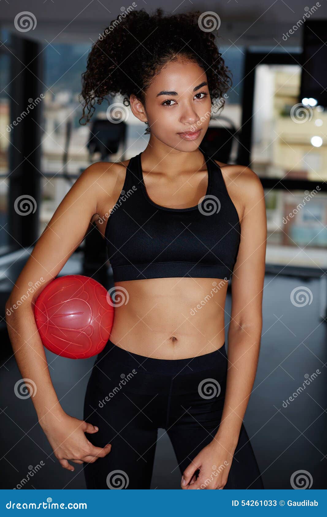 Young Athletic Woman Having a Rest after Fitness Training at Gym