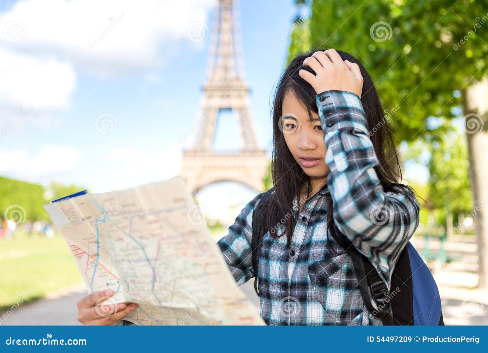 young attractive asian tourist lost in paris