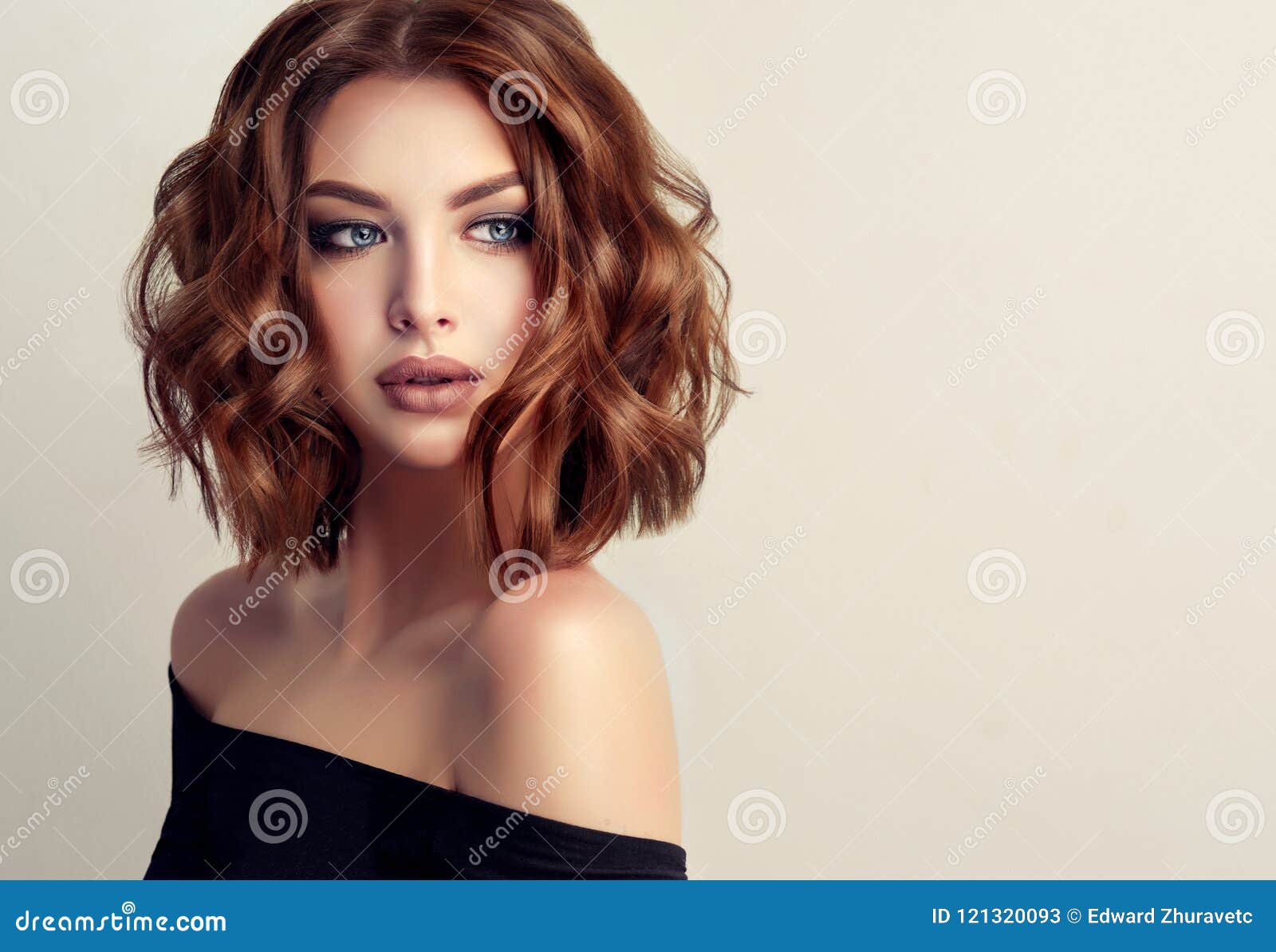 young and attractive brown haired woman with modern, trendy and elegant hairstyle.