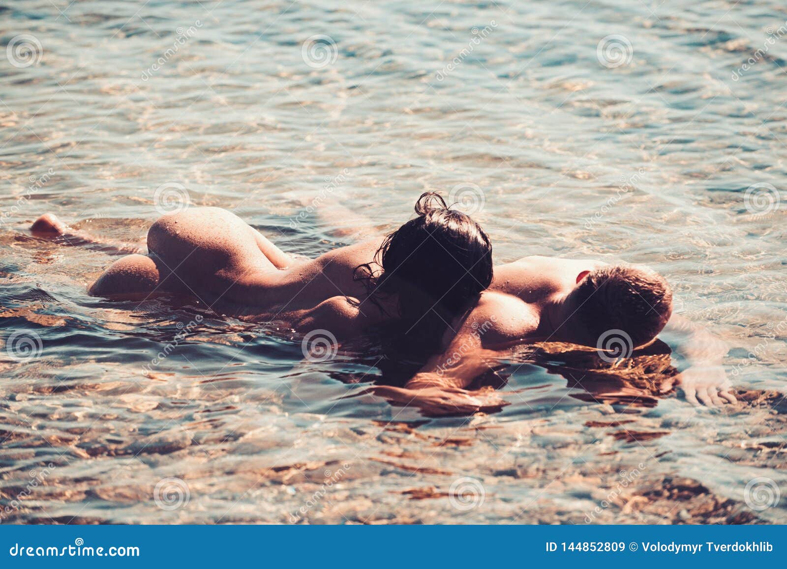 Young Attractive Couple Having Sex on the Beach