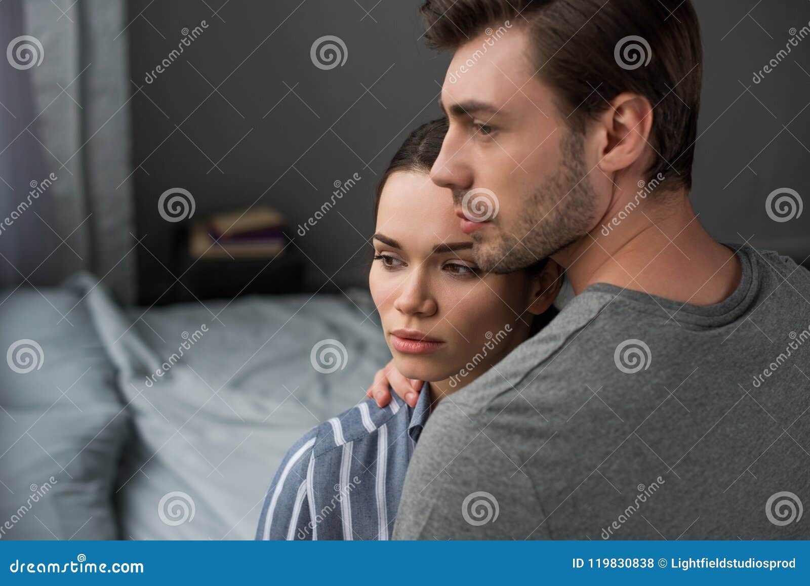 Young Attractive Couple Hugging In Bedroom Stock