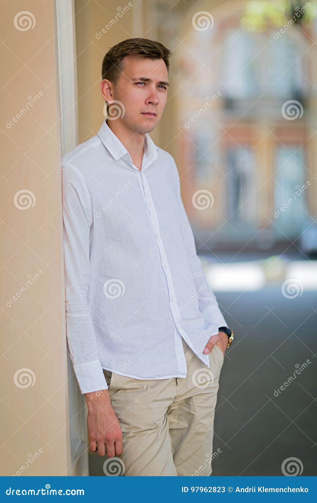 Full Length Fashionable Man in White Shirt and Beige Pants with Suspenders  Posing Near Old Wooden Ladder on Brick Wall Background Stock Image - Image  of cool, elegance: 146228817