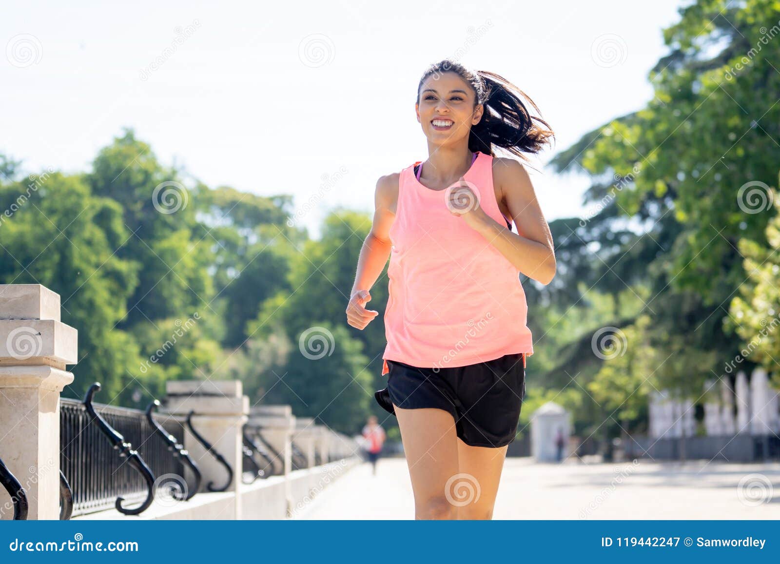 Young Attractive Happy Runner Working Out in a City Party in Fitness ...