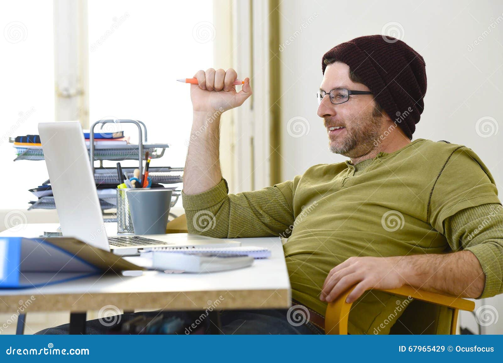 young-attractive-hipster-businessman-working-home-office-as-freelancer-self-employed-business-model-corporate-portrait-67965429.jpg