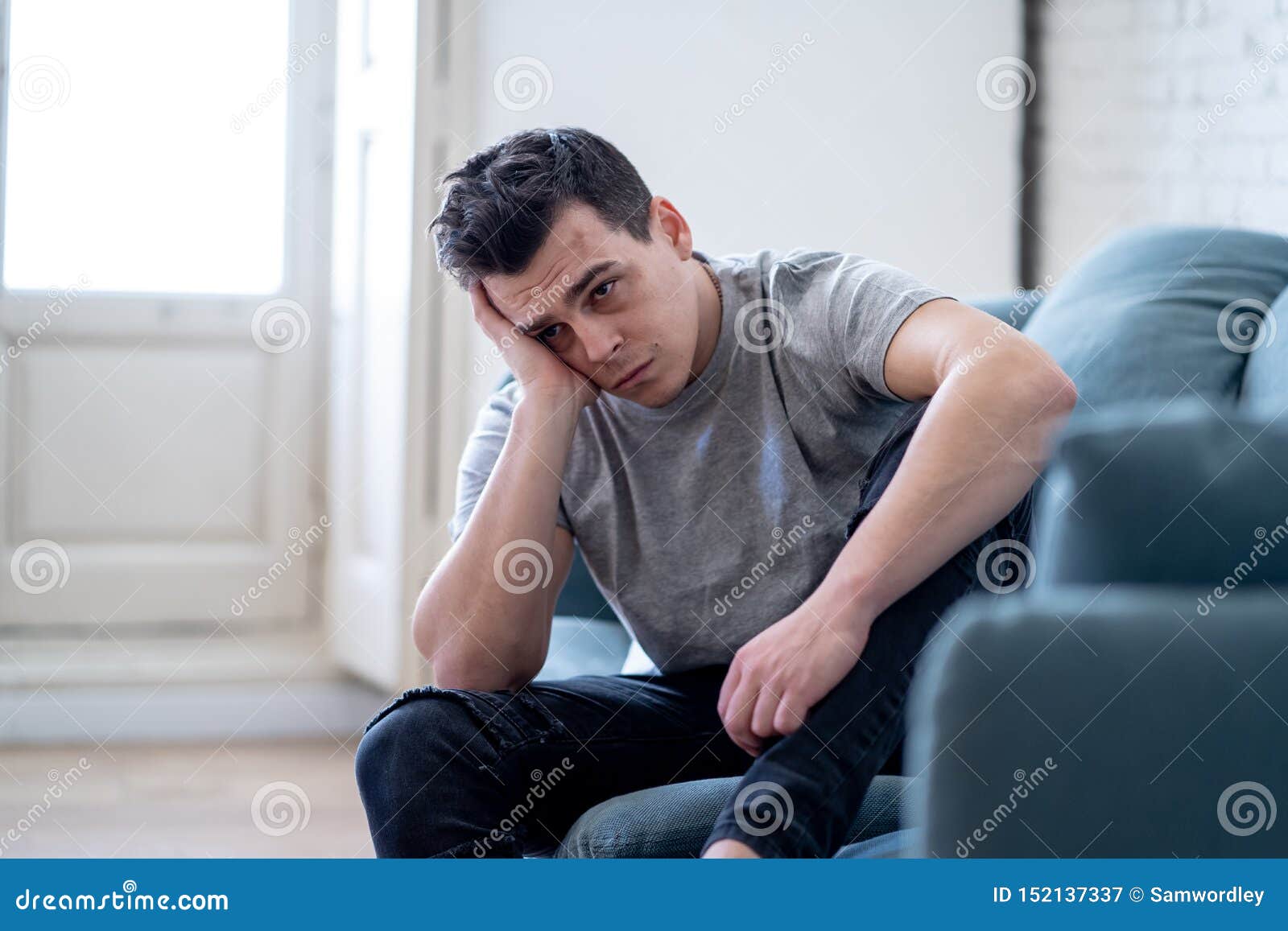 Young Attractive Man Suffering from Depression in Emotional Pain Lying ...