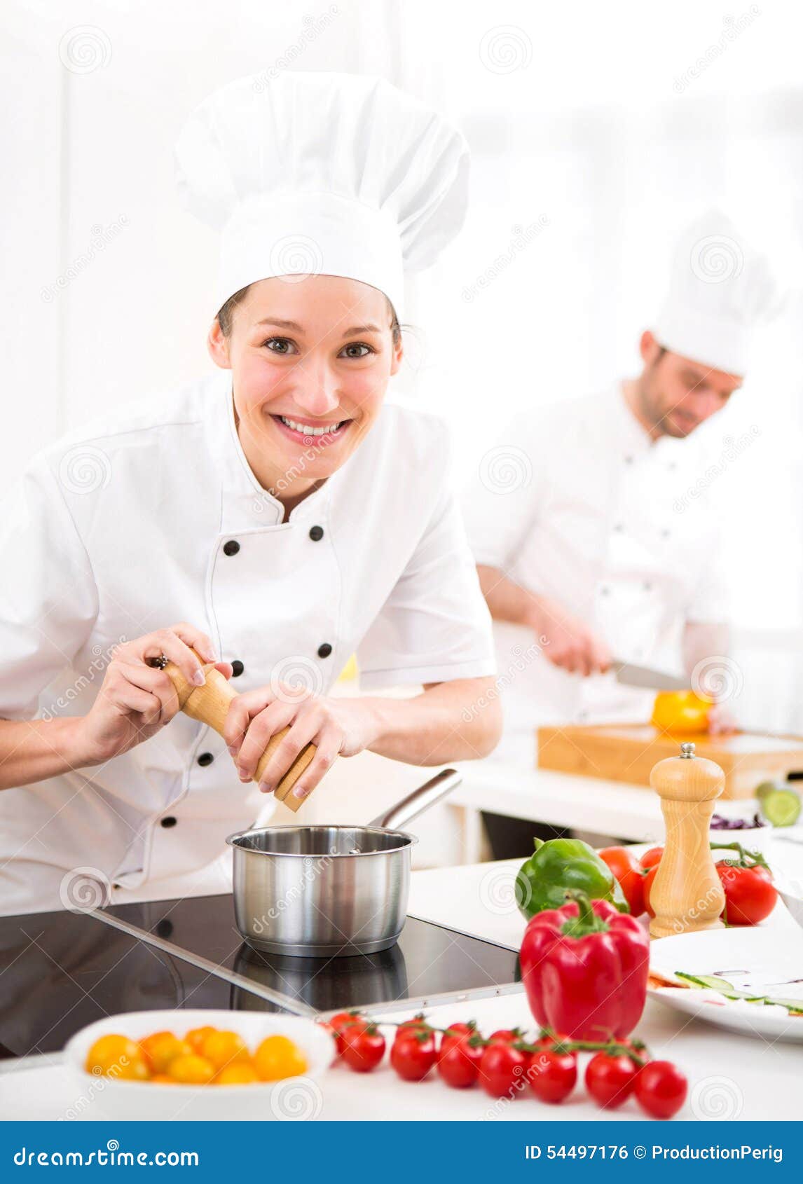 Young Attractive Professional Chef Cooking in His Kitchen Stock Photo
