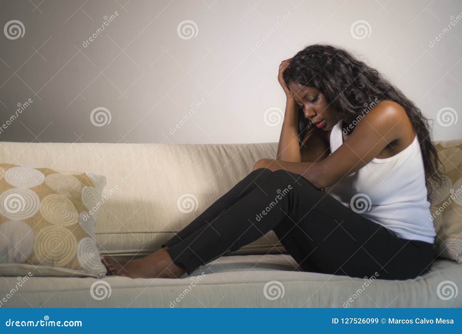 Young Attractive and Sad Black African American Woman Sitting Depressed