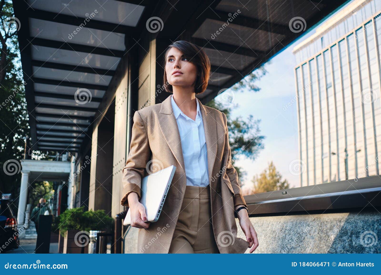 Young Attractive Stylish Businesswoman with Laptop Thoughtfully Walking ...