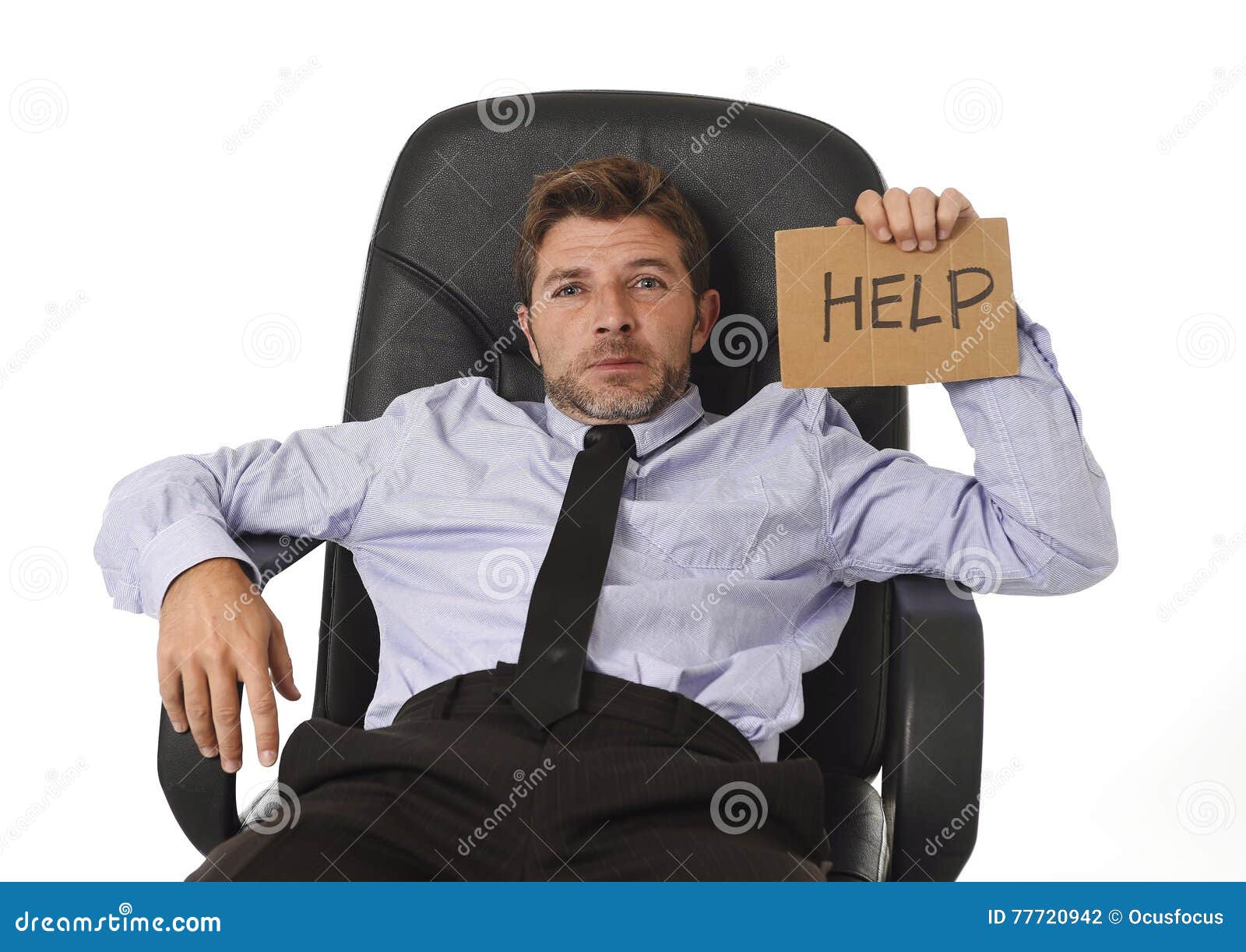 young attractive tired and wasted businessman sitting on office chair asking for help in stress