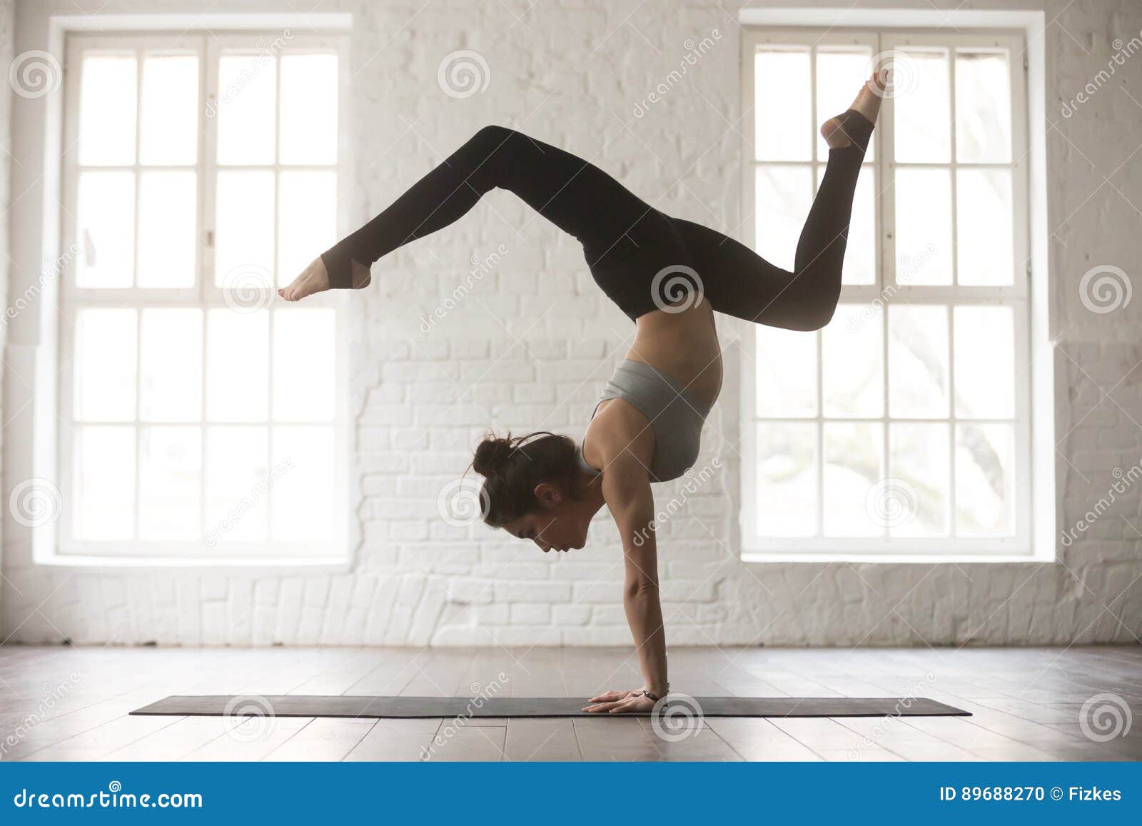 Young Attractive Woman in Adho Mukha Vrksasana Pose, White Studi Stock  Photo - Image of healthy, home: 89688270
