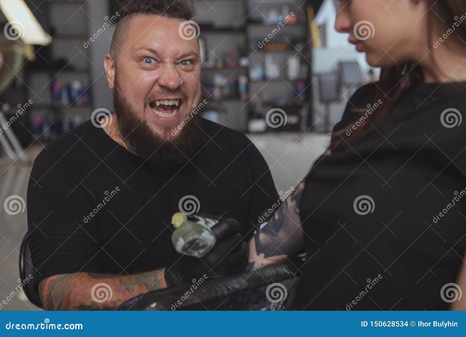 Young Attractive Woman Getting New Tattoo by Professional Tattooist