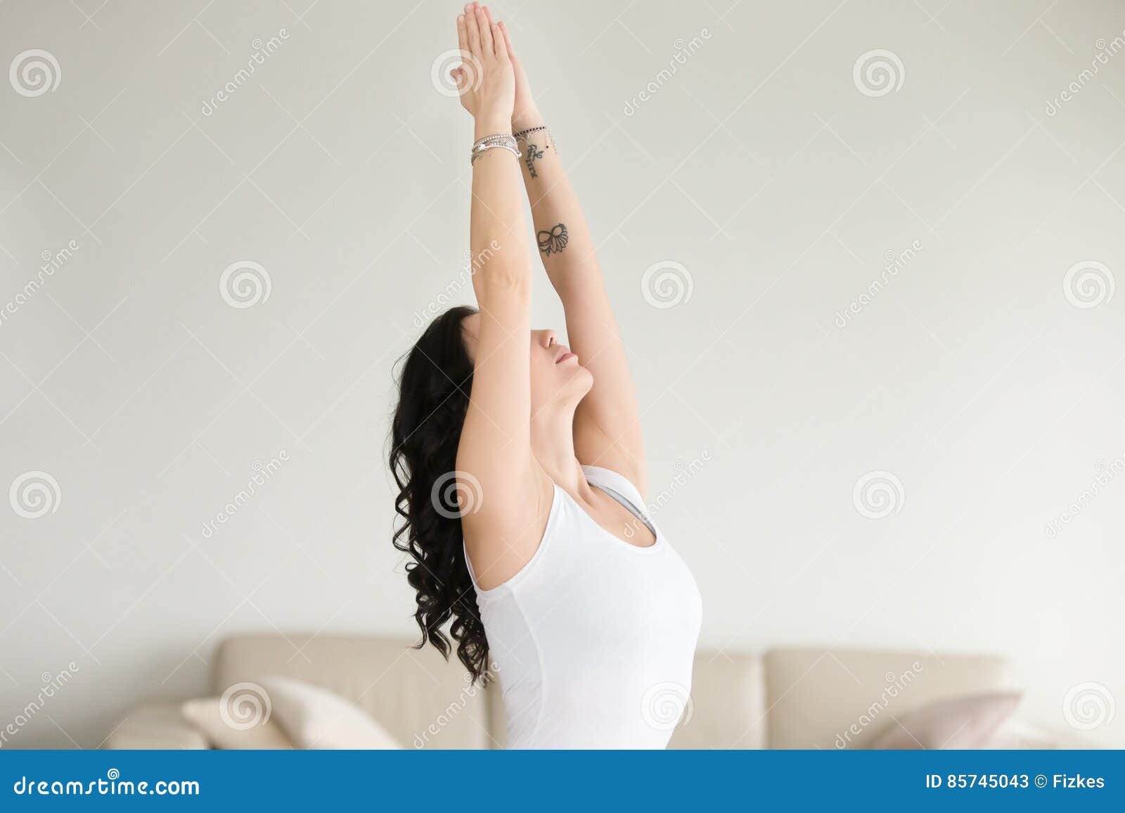 young attractive woman in tadasana pose, at living room, closeup