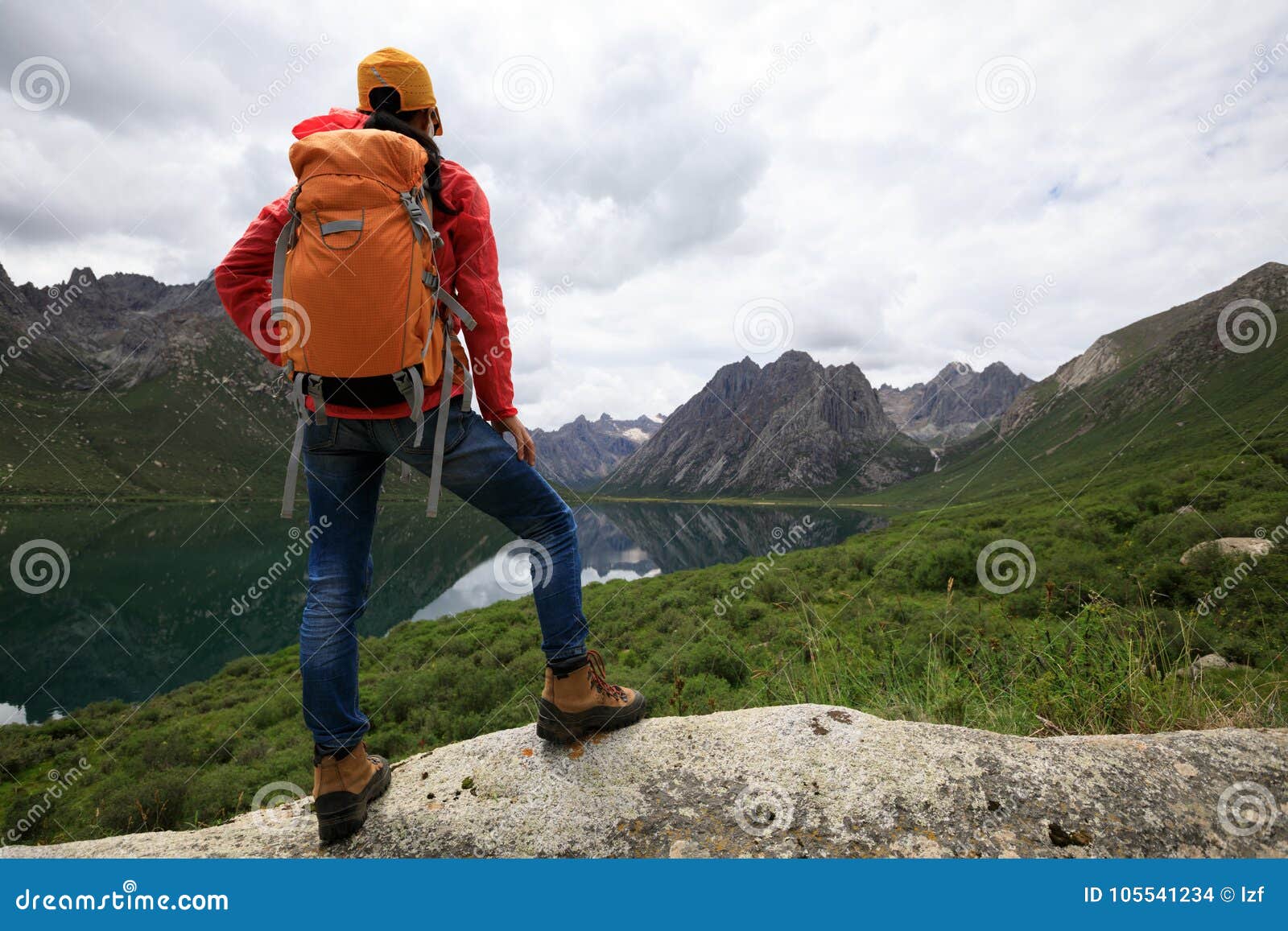 backpacking woman hiking in mountains