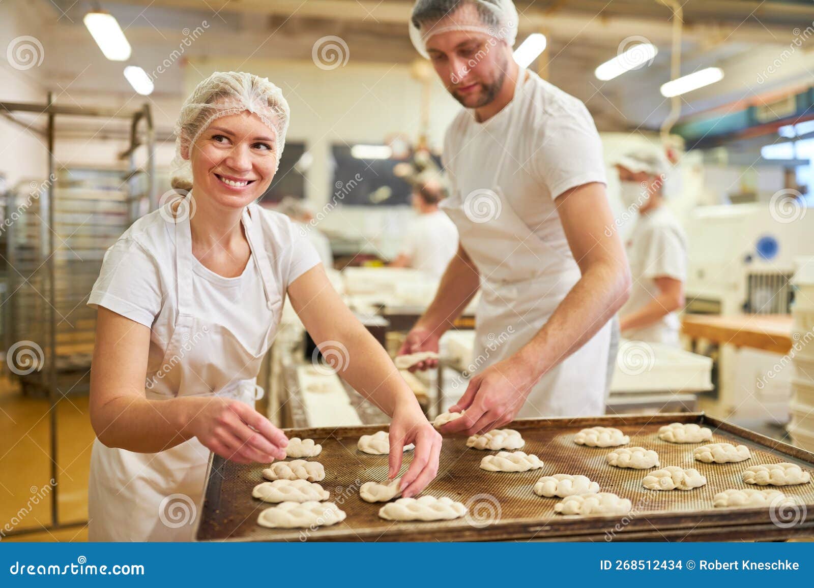Young Bakers on the Baking Tray Bake the Yeast Plait Stock Photo