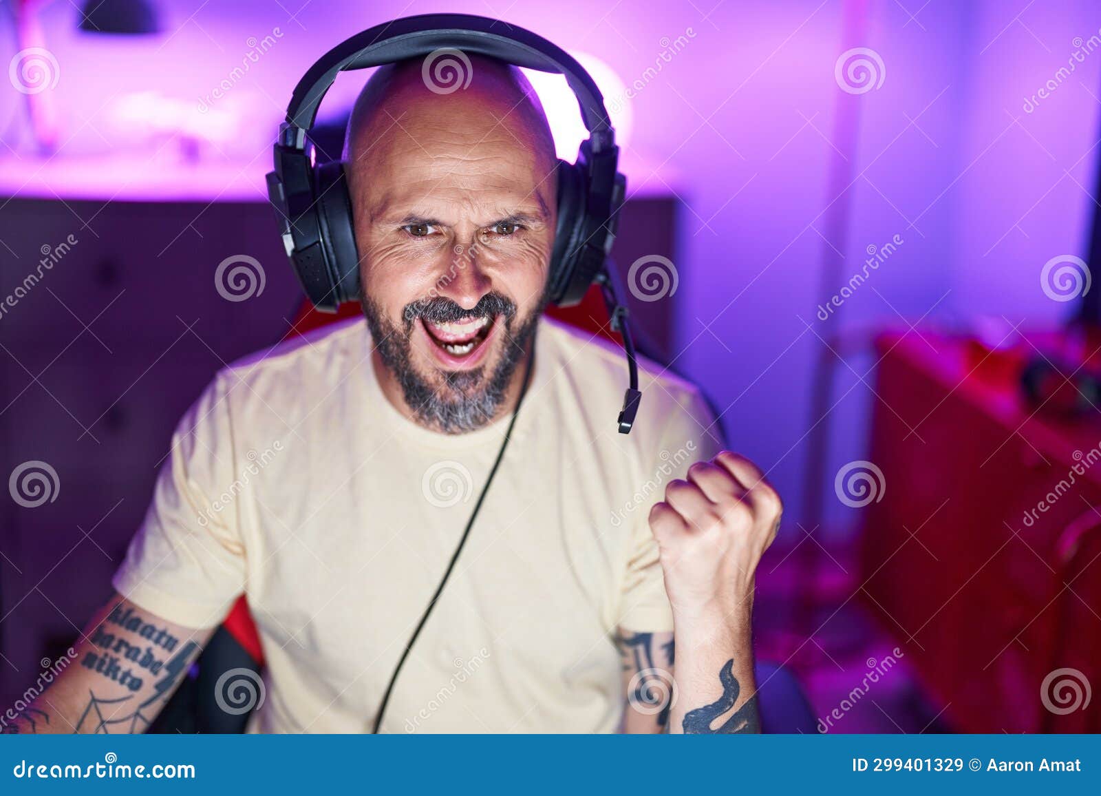 Young Bald Man Streamer Playing Video Game with Winner Expression at