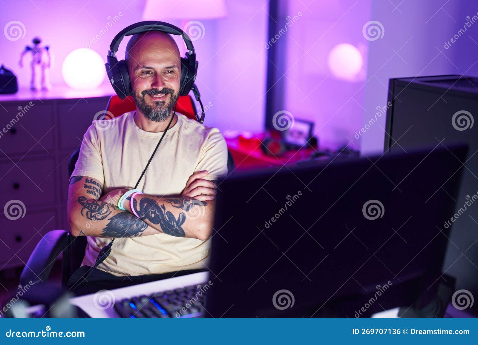 Young Bald Man Streamer Smiling Confident Sitting with Arms Crossed