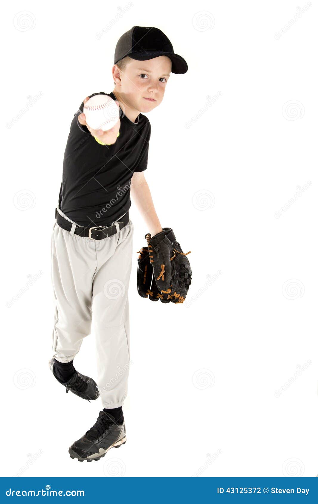 Young Baseball Player Throwing the Ball into the Camera Stock Photo