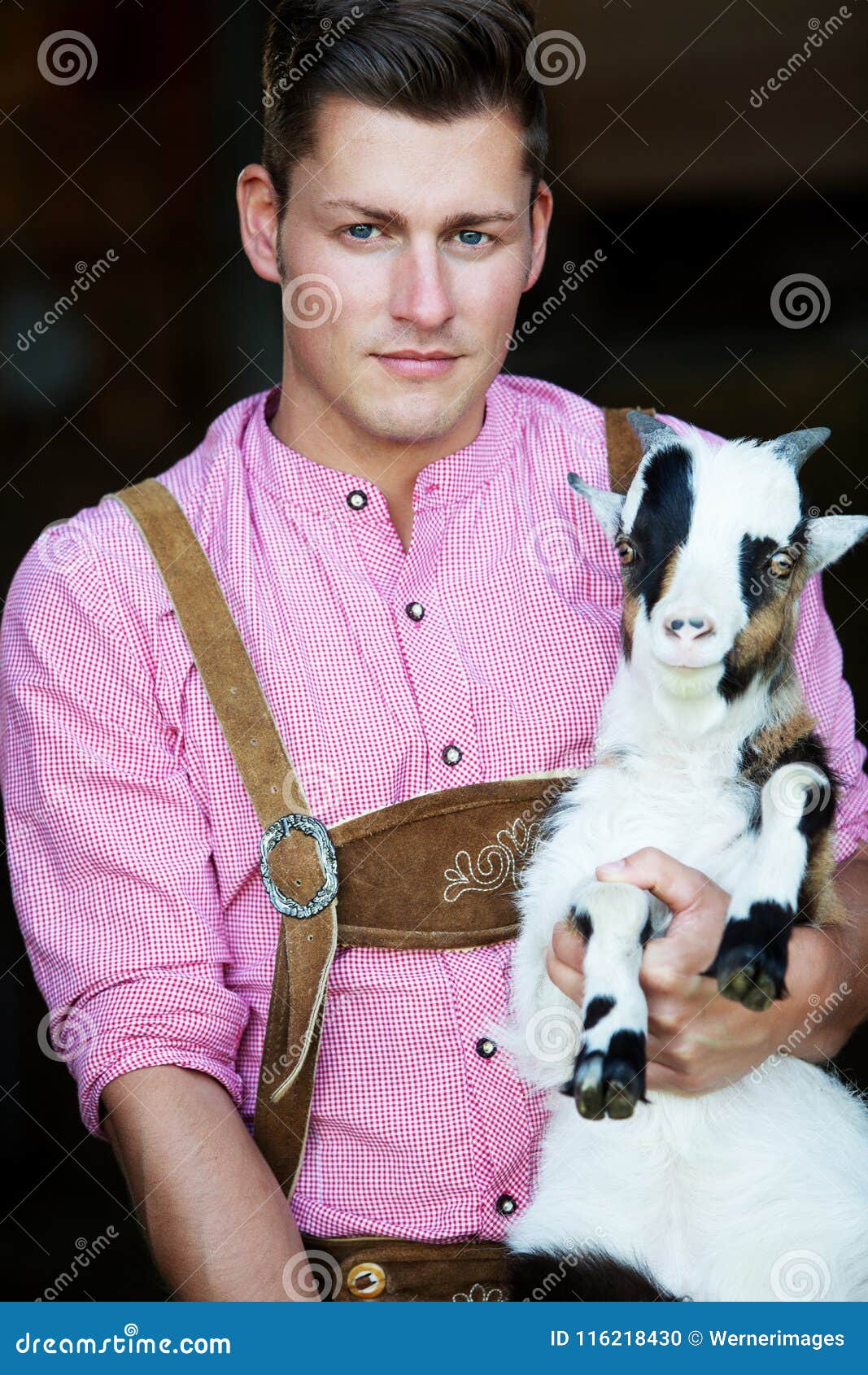 Young Bavarian Man Holding a Goat Stock Photo Image of bavaria