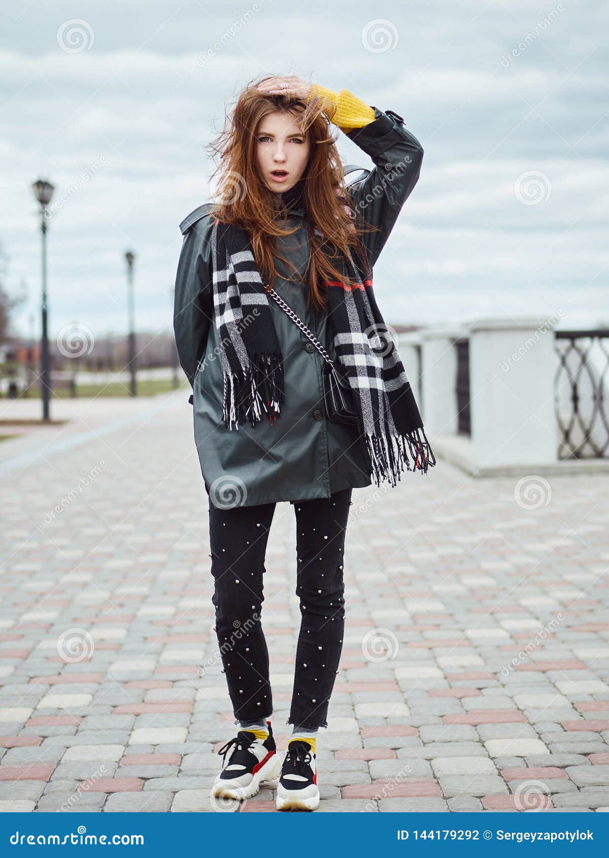 Young Beautiful Amazed Redhead Woman in Stylish Trench Coat, Blue Jeans ...