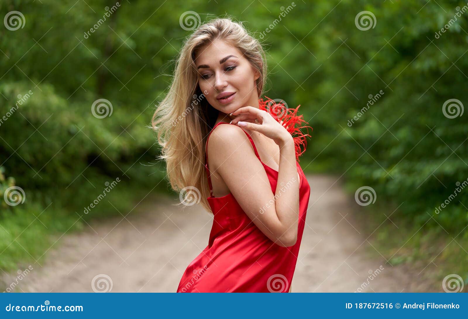 Young, Beautiful Blond Woman with Bright Make-up and with Long Hair in ...