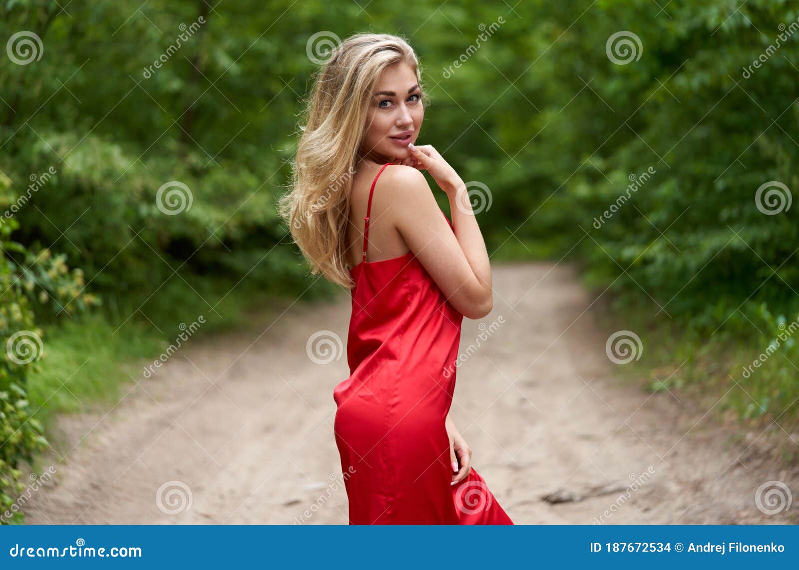 Young, Beautiful Blond Woman with Bright Make-up and with Long Hair in ...