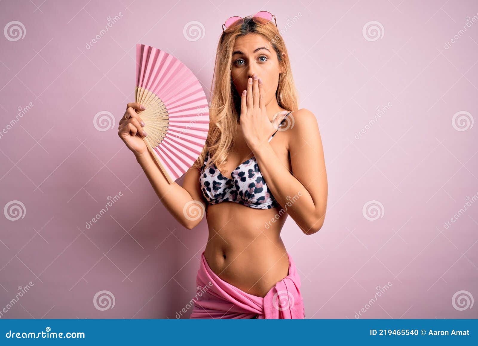 Sexy woman play with glass fan pic