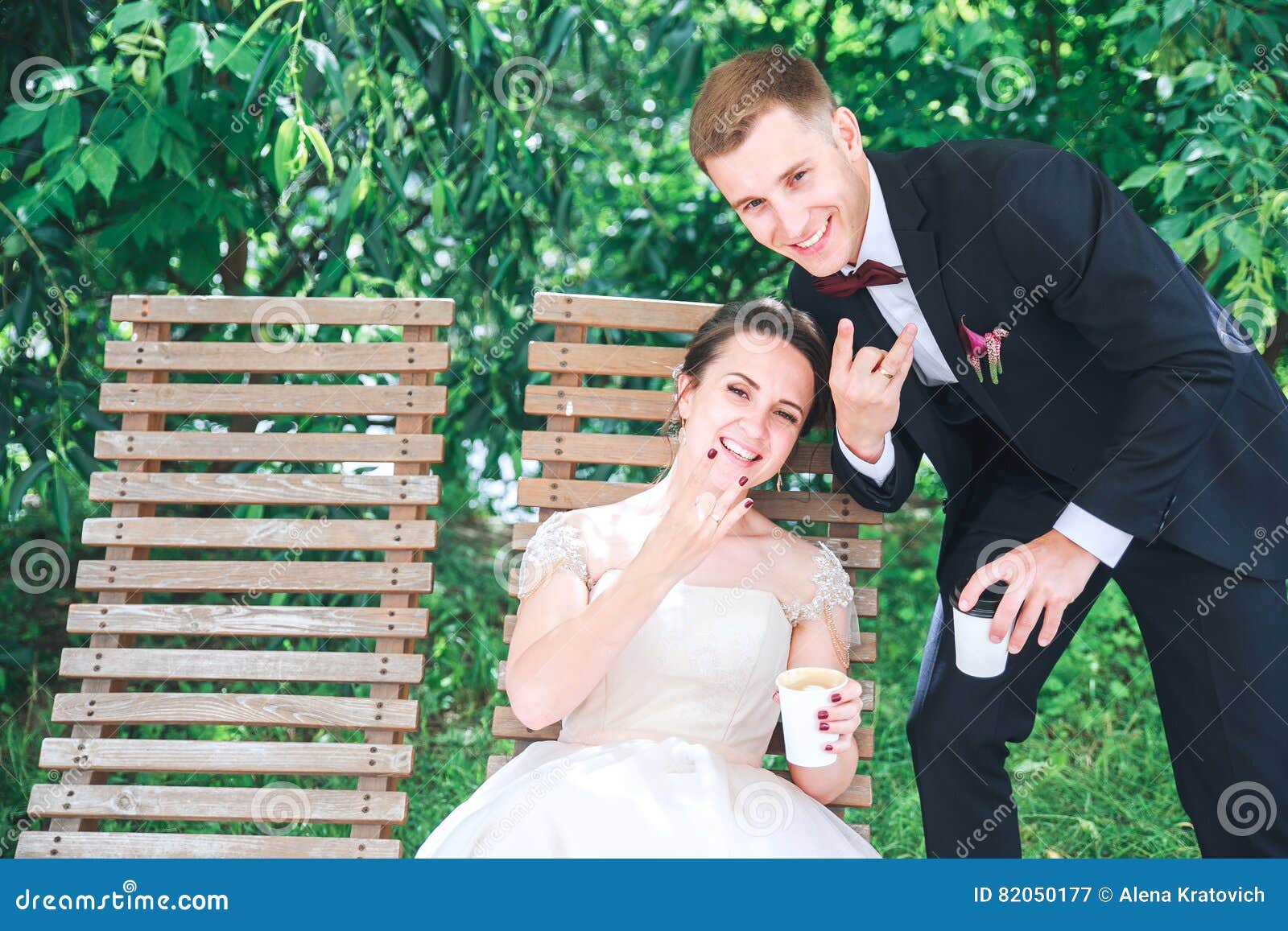 Young Beautiful Bride And Groom Drinking Coffee At The Outdoors
