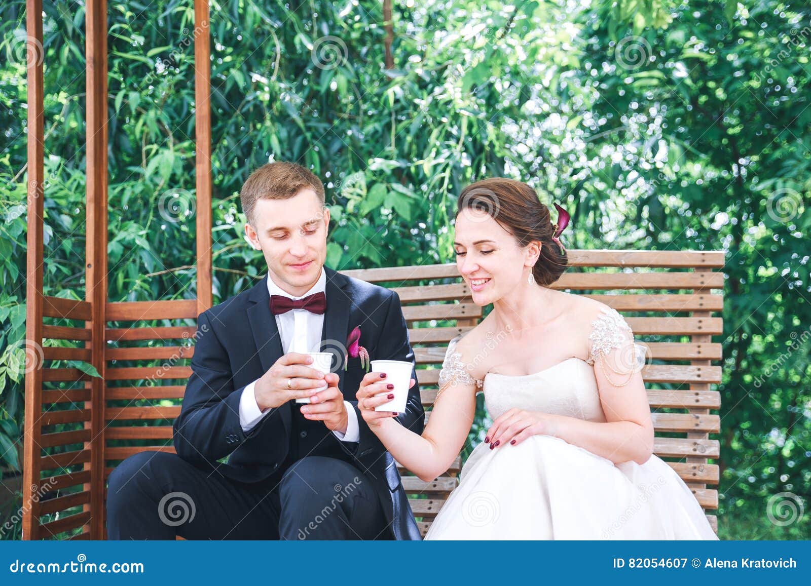 Young Beautiful Bride And Groom Drinking Coffee At The Outdoors