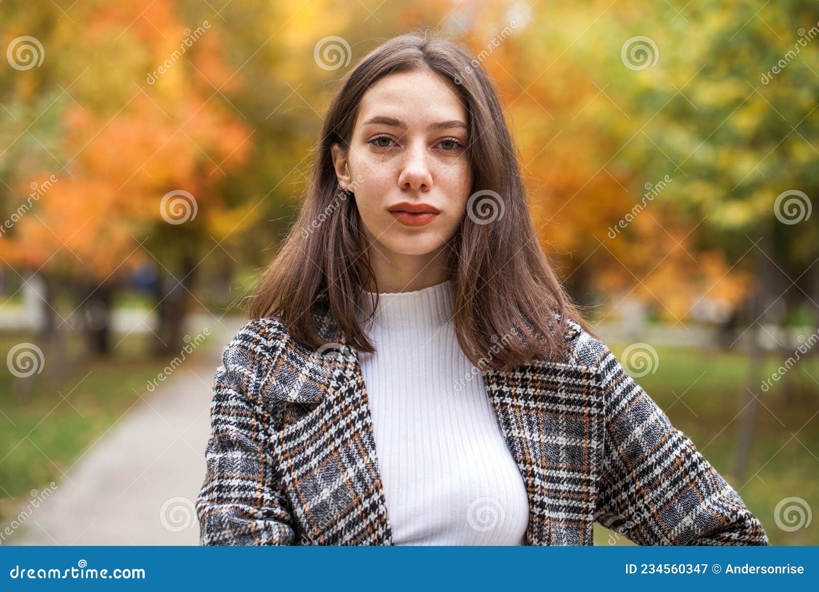 Young Beautiful Brown Haired Girl With Freckles On Her Face Stock Image