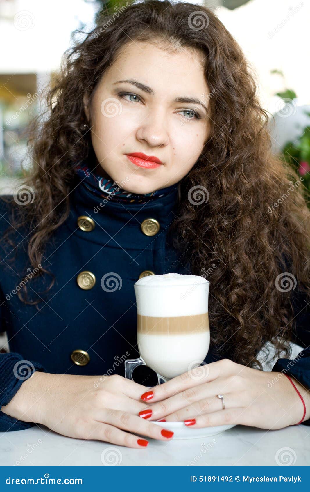 Young Beautiful Brunette With A Delicious Latte In A Cafe Stoc image
