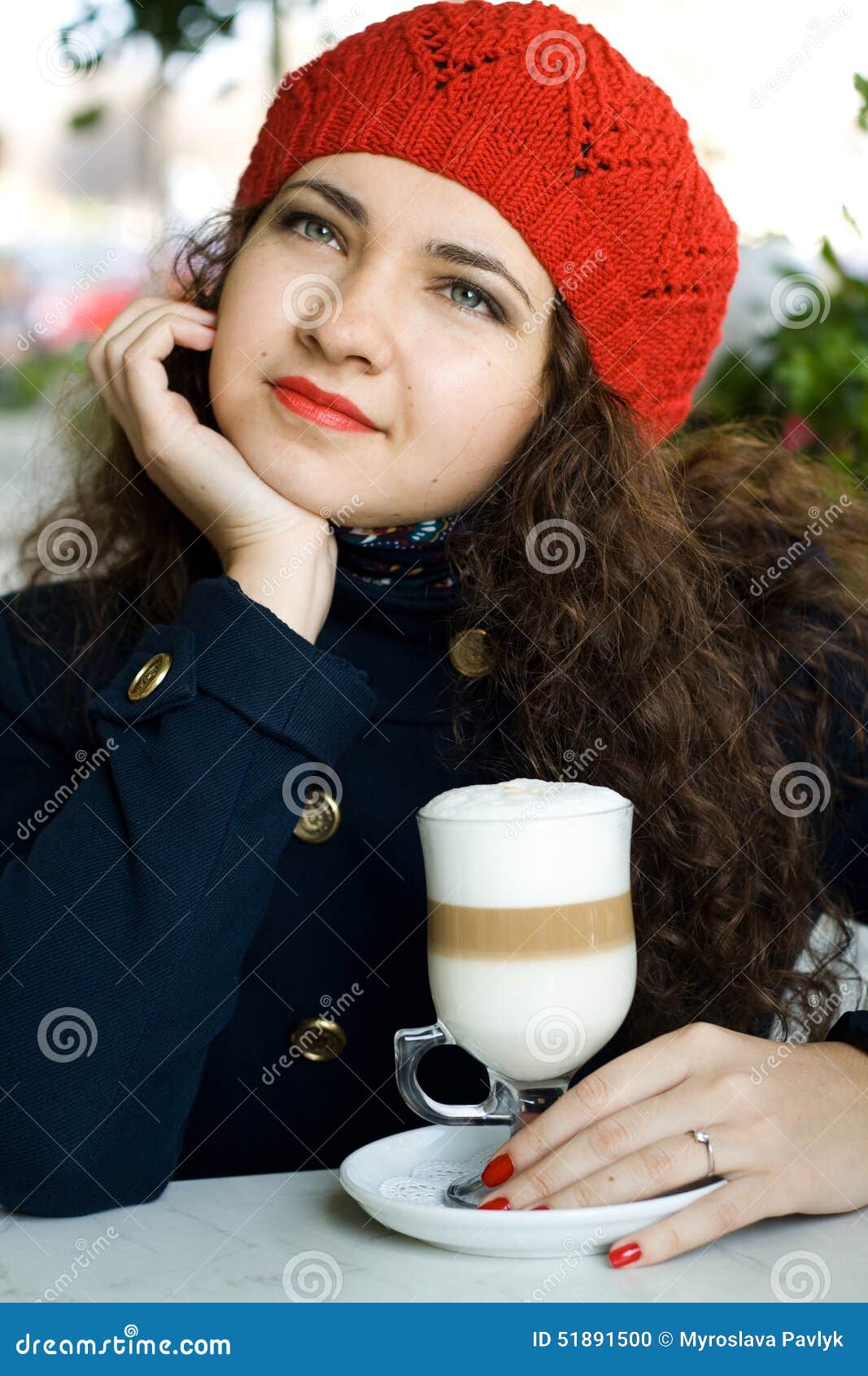 Young Beautiful Brunette with a Delicious Latte in a Cafe Stoc image