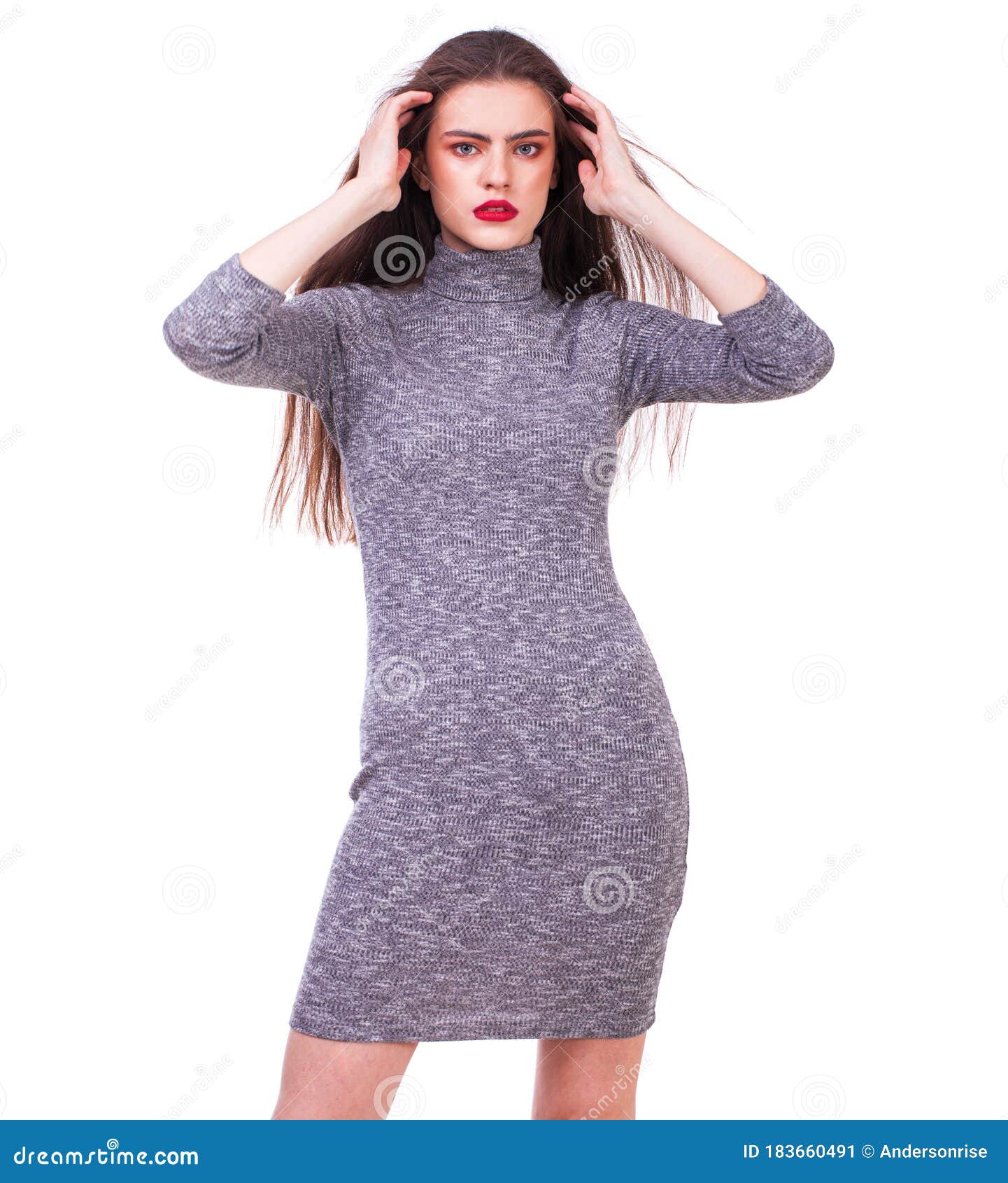 Young Beautiful Brunette Woman in a Knitted Tight-fitting Gray Dress ...