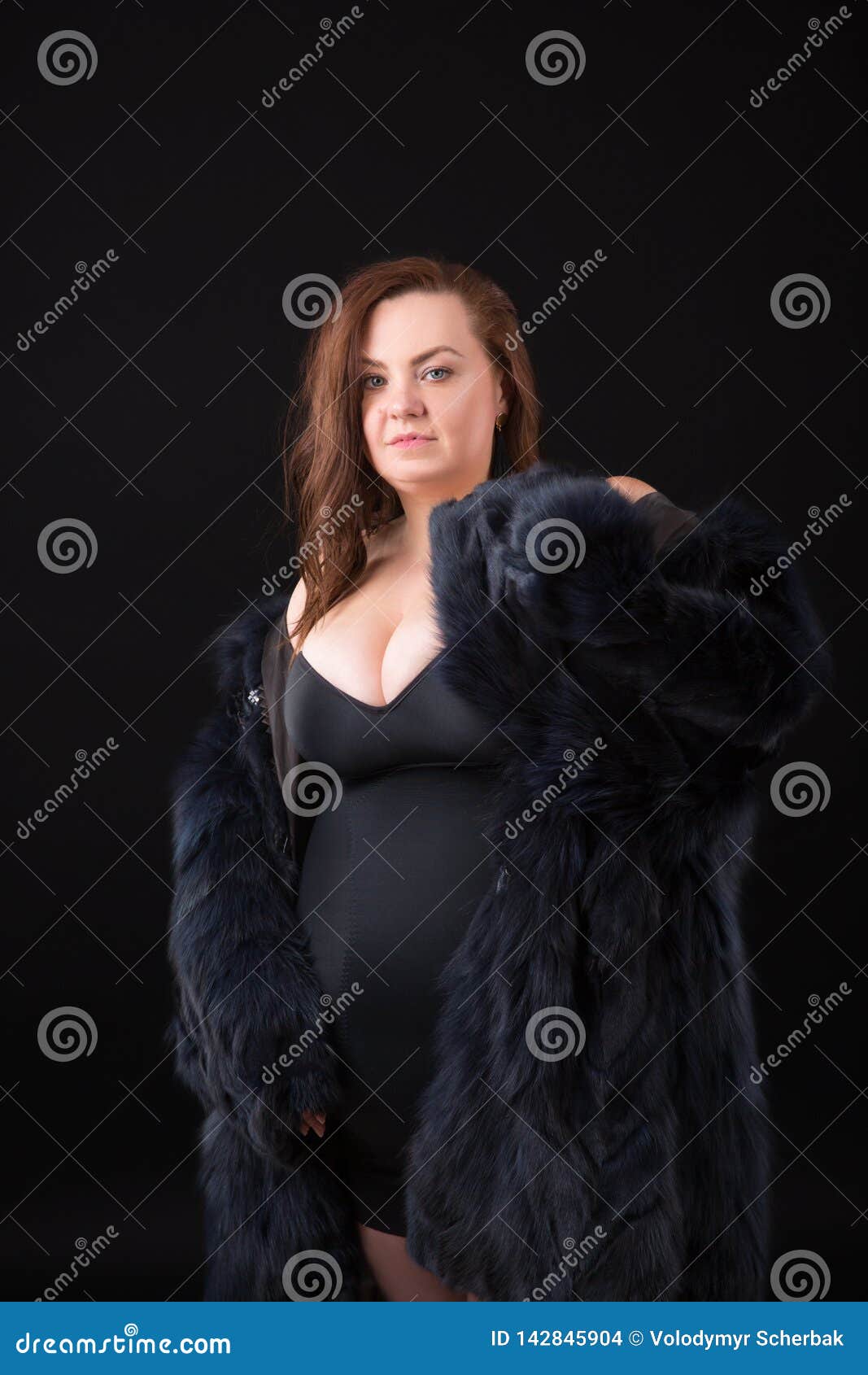 Young Beautiful Busty Curvy Plus Size Model with Big Breast in Black  Artificial Fur Coat, Xxl Woman on Black Background Stock Photo - Image of  bust, background: 142845904