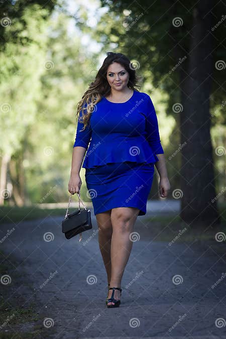 Young Beautiful Caucasian Plus Size Fashion Model in Blue Dress ...