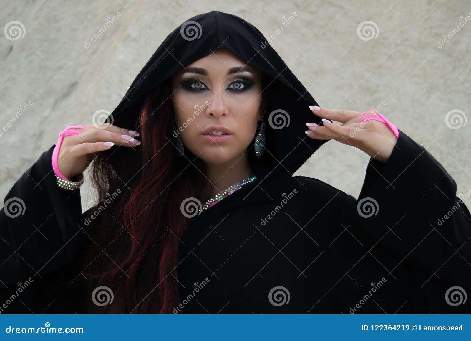 young beautiful caucasian woman posing in abaya in empty quarter desert