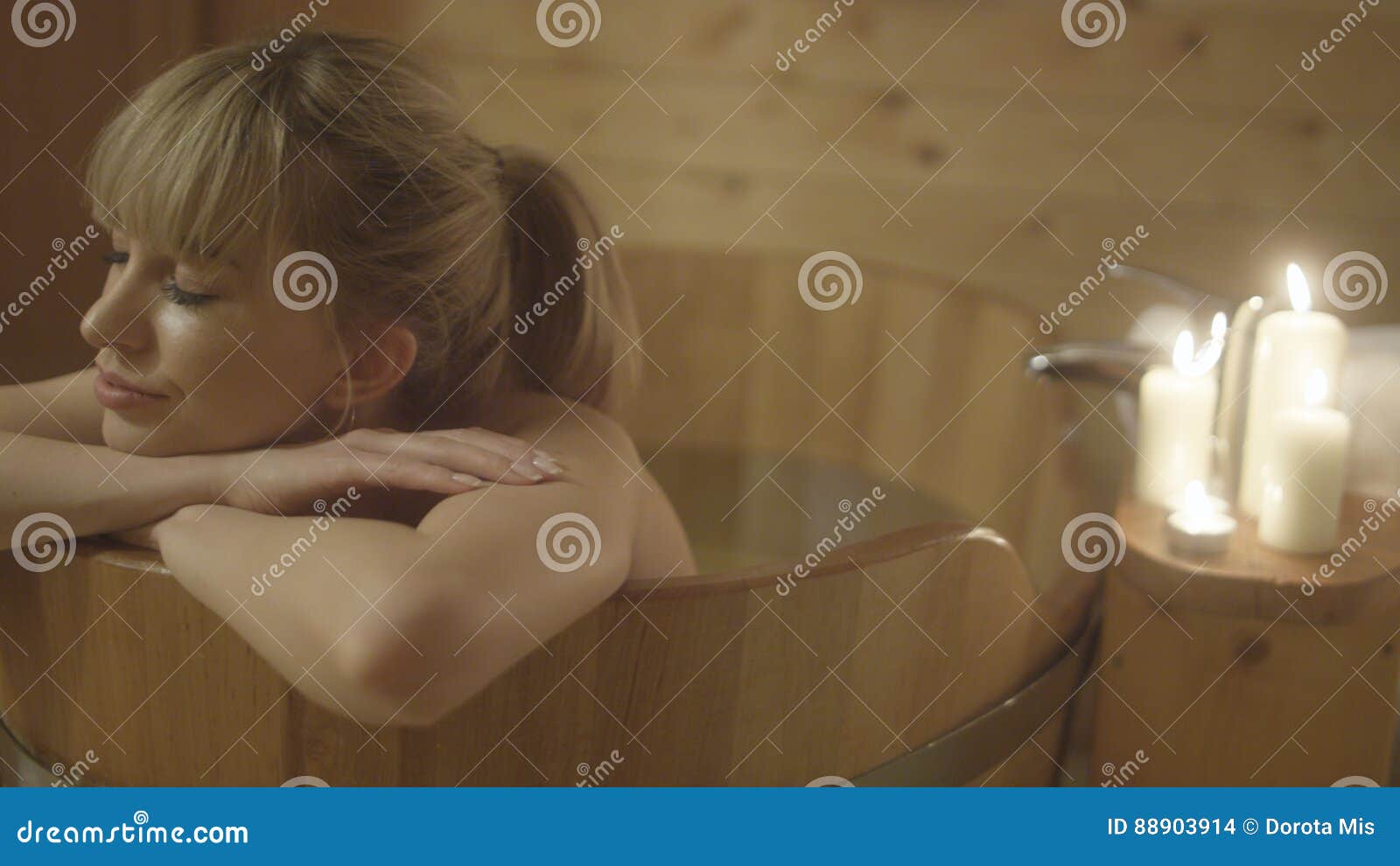 Young Beautiful Caucasian Woman Taking Bath In A Wooden Tub Stock