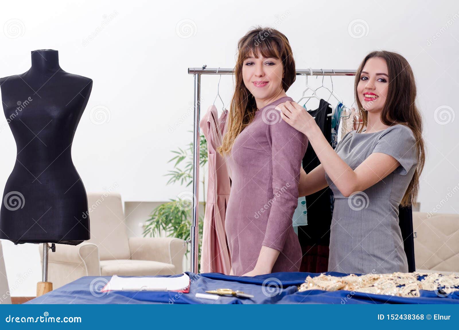 Young Beautiful Female Tailor Taking Measurements Stock Photo - Image ...