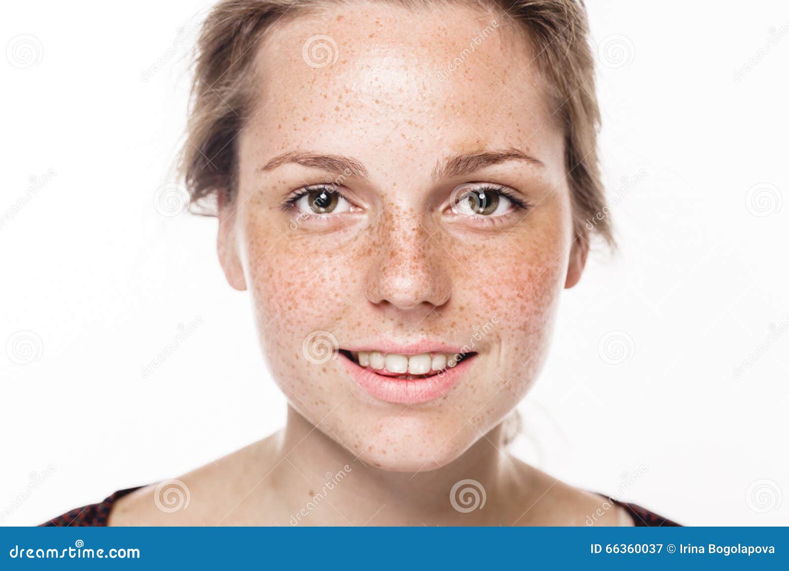 young beautiful freckles woman face portrait with healthy skin