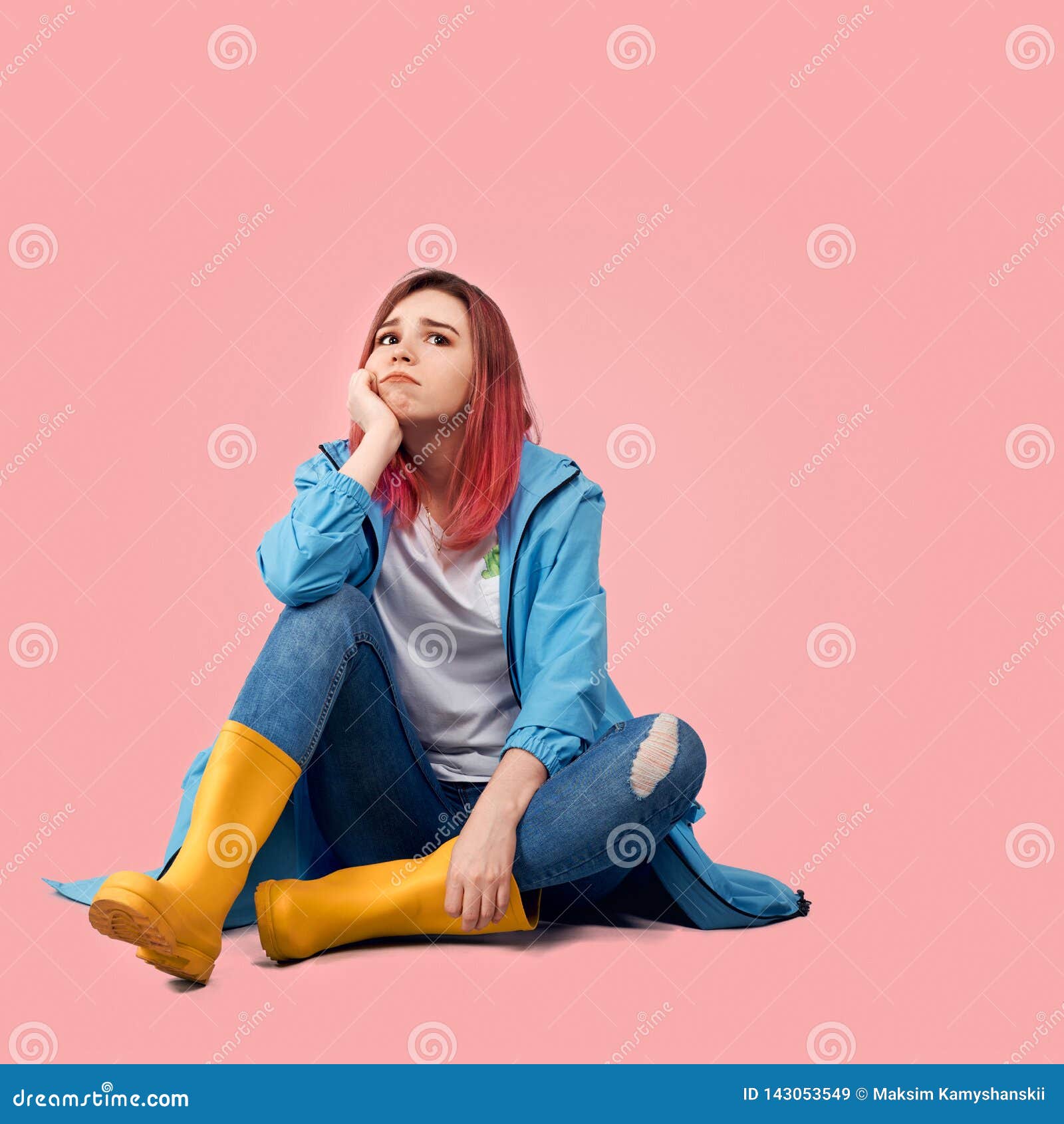 Young Beautiful Girl in Blue Coat and Yellow Rubber Boots Sits with Sad ...