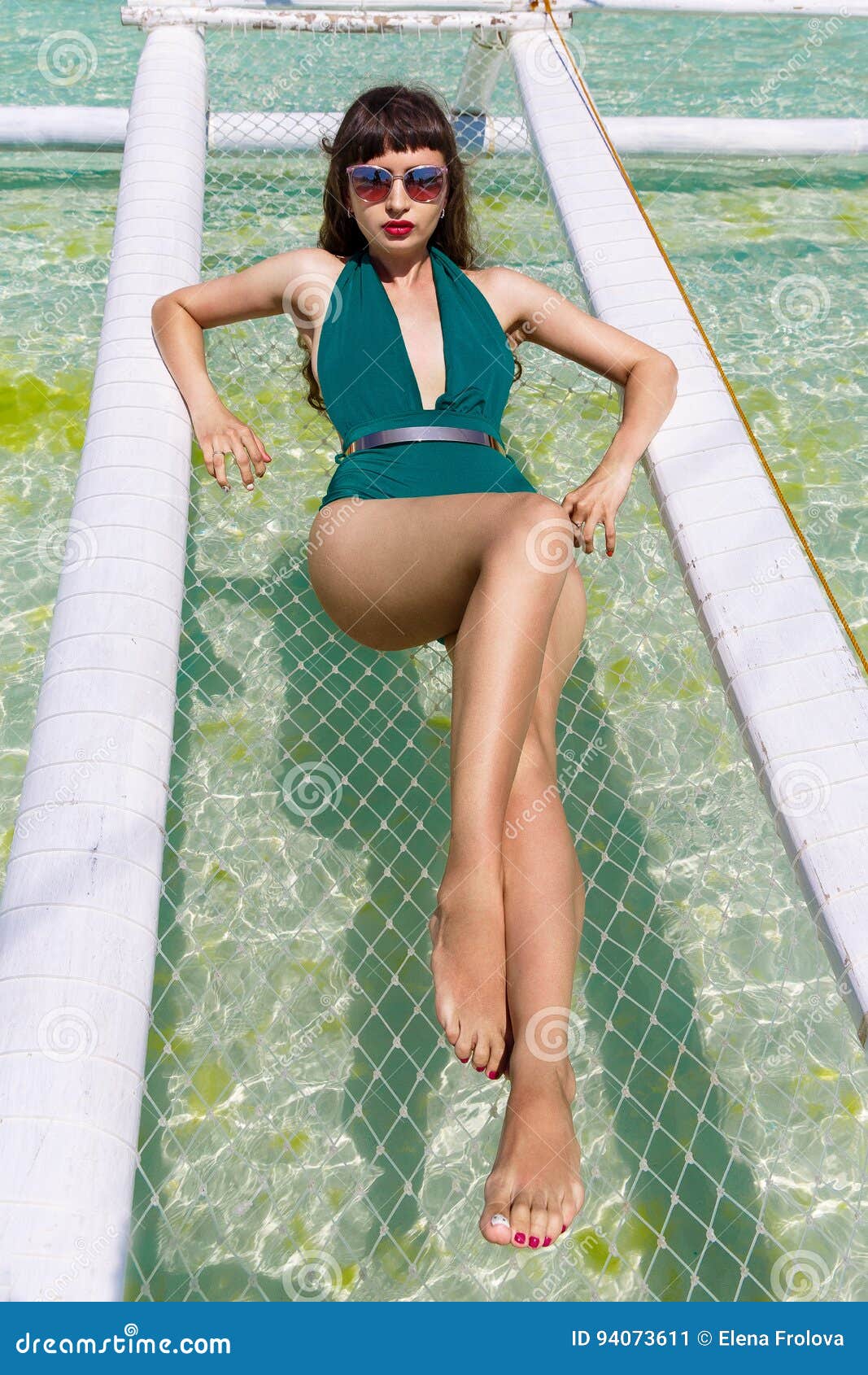 Young Beautiful Girl In A Green Bikini On A Tropical Beach 