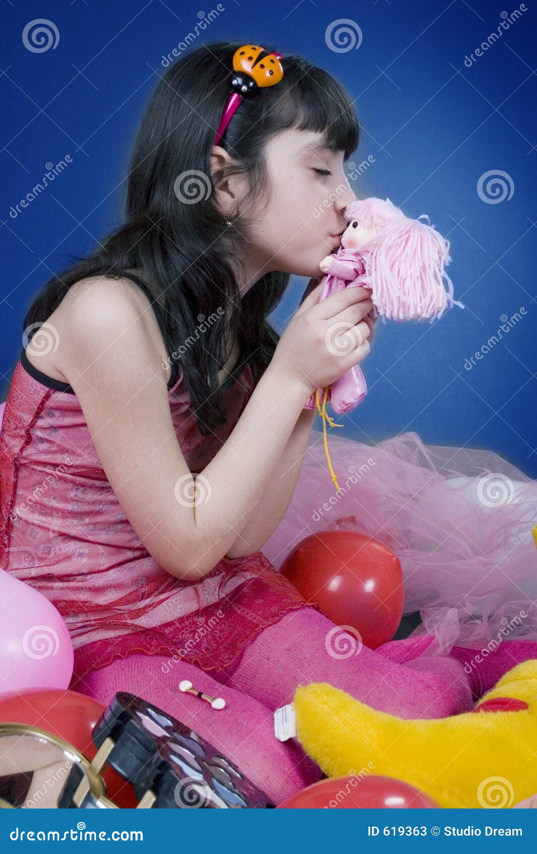 Young And Beautiful Girl Kissing Her Doll Stock Ima