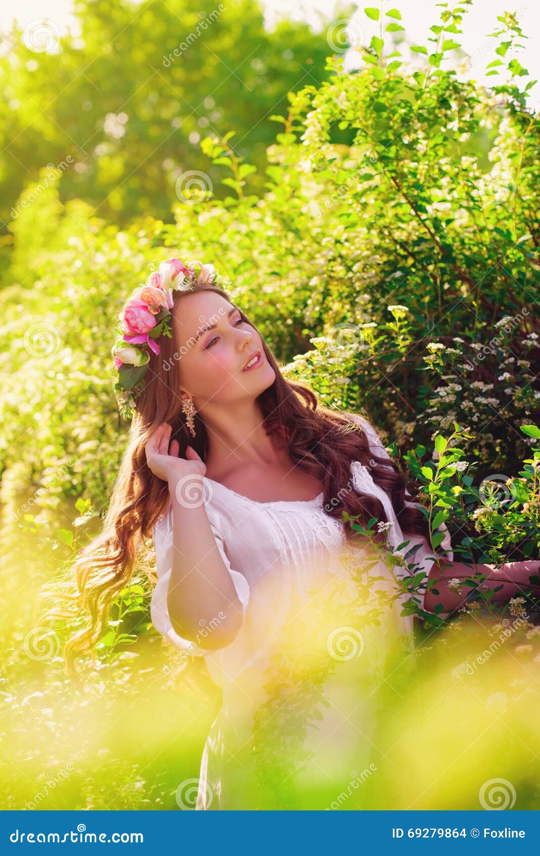 Young Beautiful Girl with Long Hair in Floral Wreath in the Spring ...