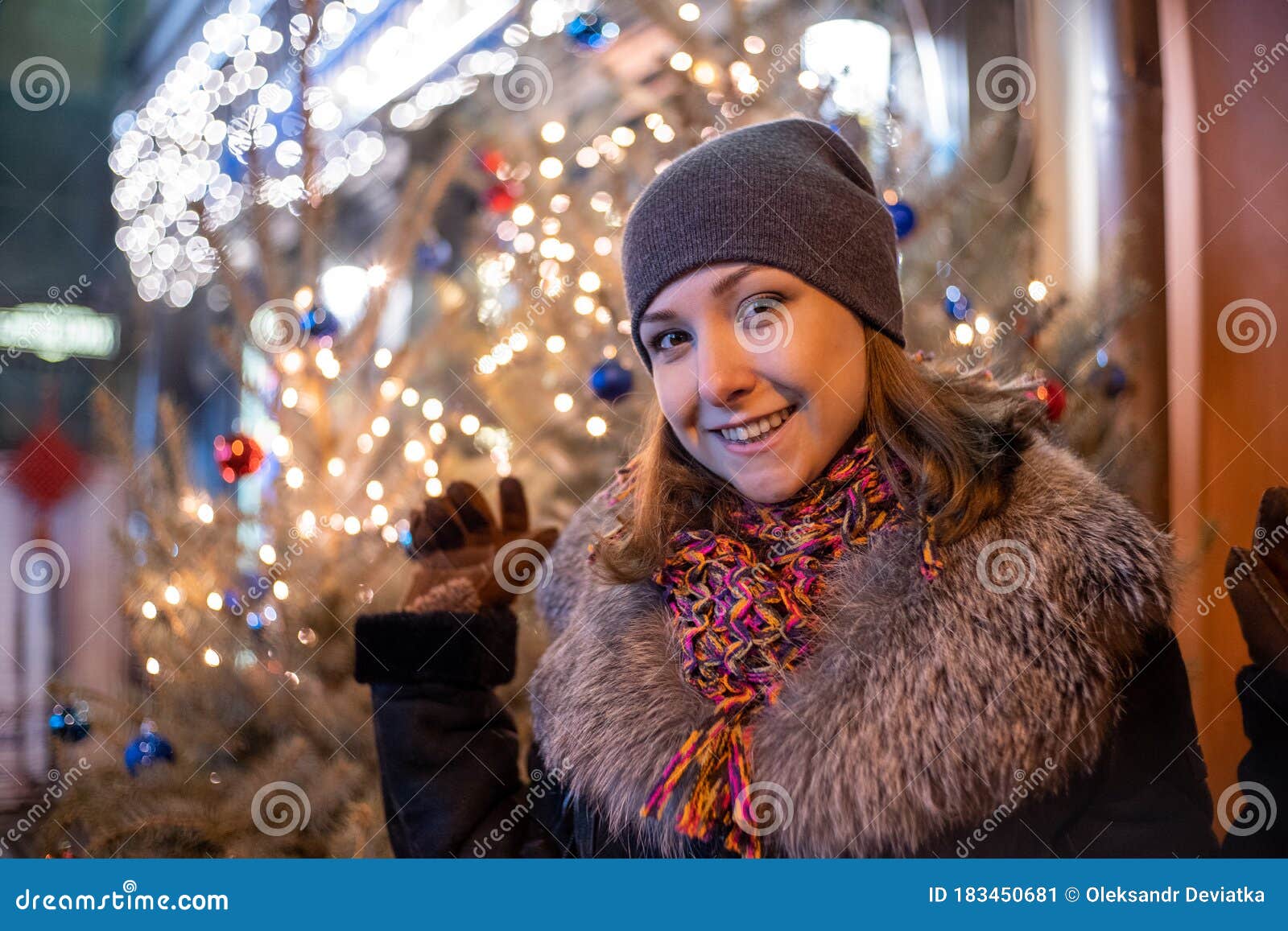 Young Beautiful Girl in New Year Decorations on the Street in Winter ...