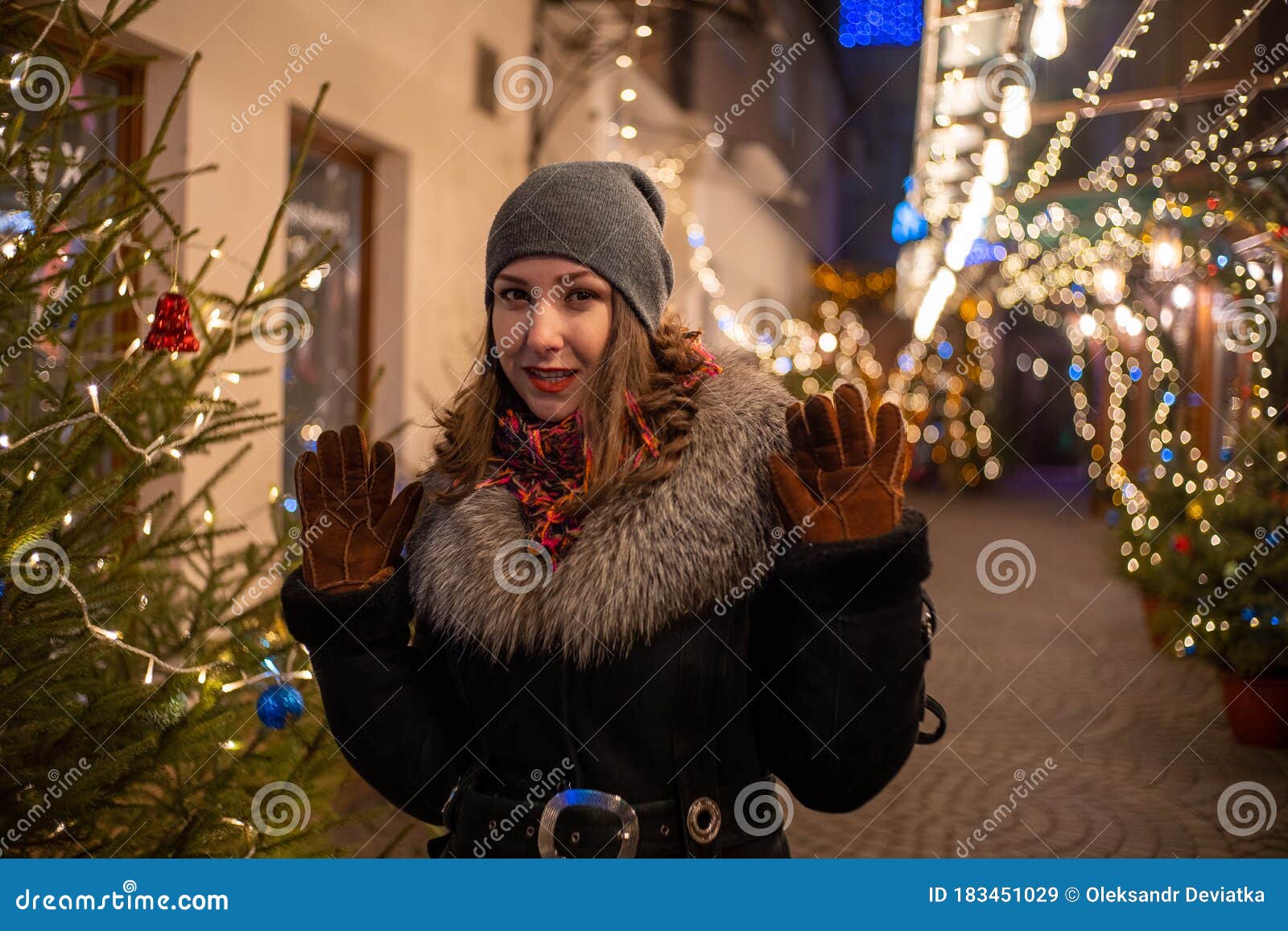 Young Beautiful Girl in New Year Decorations on the Street in Winter ...