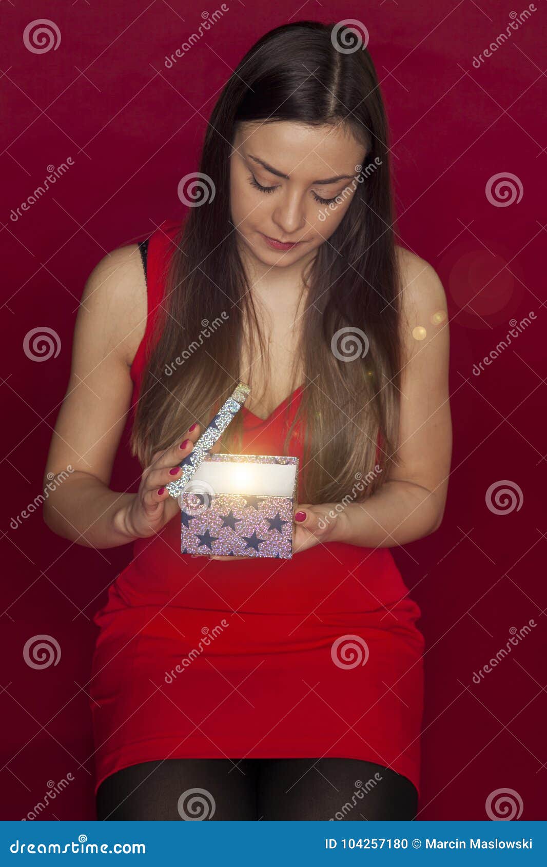 Young Beautiful Girl Opens a Magical Christmas Gift Stock Photo - Image ...