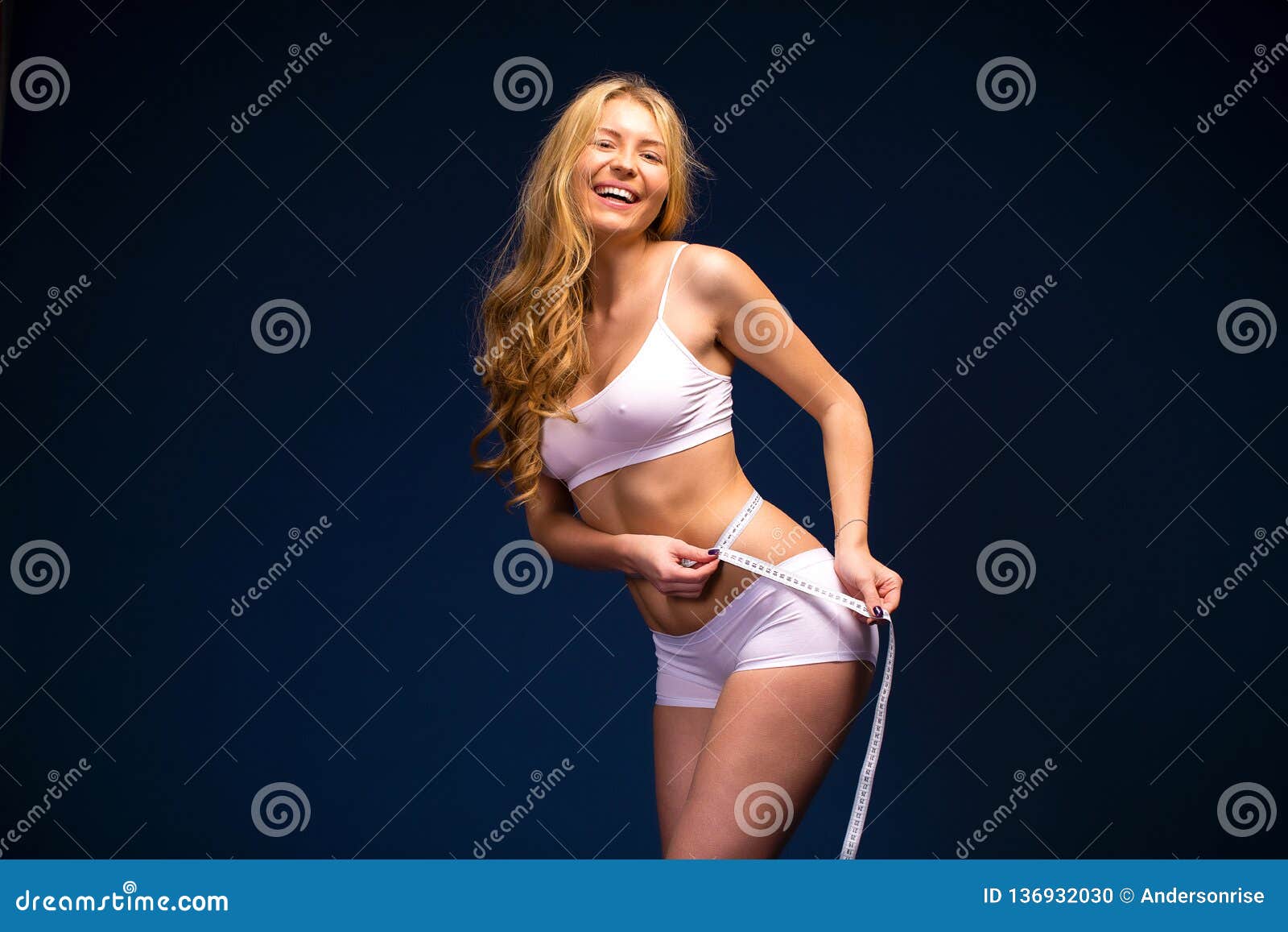 https://thumbs.dreamstime.com/z/young-beautiful-girl-posing-nude-studio-standing-blue-dress-near-white-wall-136932030.jpg