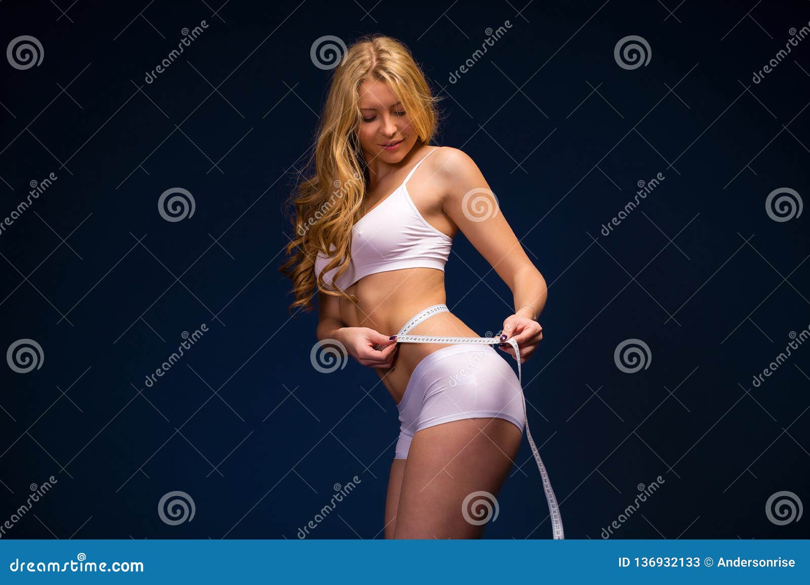 https://thumbs.dreamstime.com/z/young-beautiful-girl-posing-nude-studio-standing-blue-dress-near-white-wall-136932133.jpg