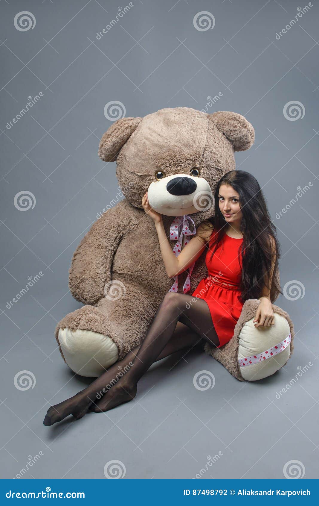 Young Beautiful Girl in Red Dress with Big Teddy Bear Soft Toy ...