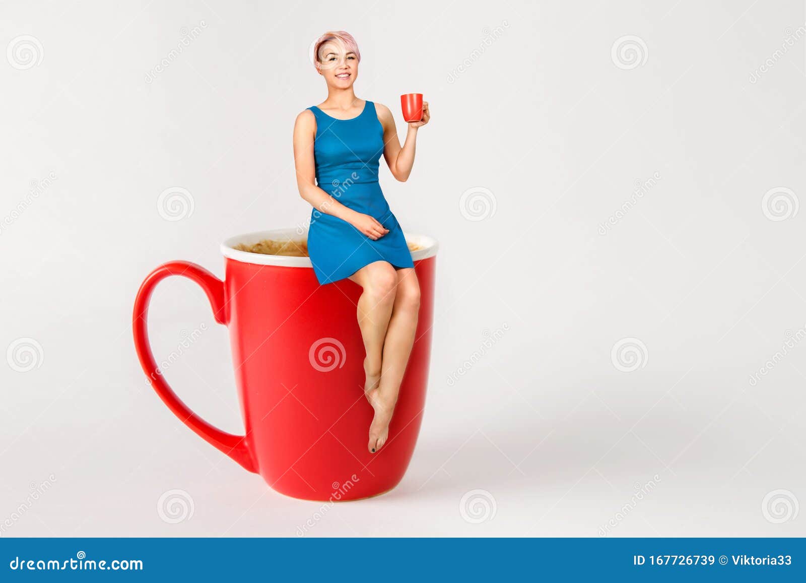 Young Beautiful Girl Sits on a Big Cup of Coffee and Drinks Coffee on a  Light Background Stock Image - Image of cafe, cappuccino: 167726739