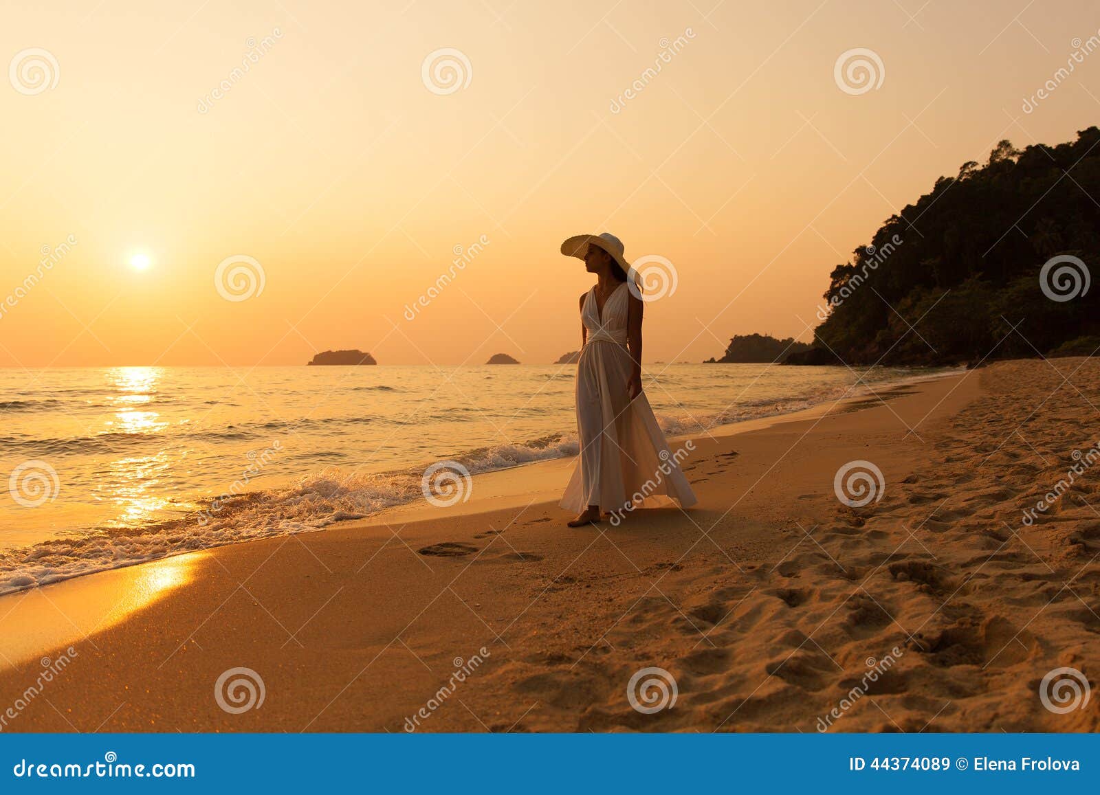 Young Beautiful Girl in a White Dress and Straw Hat on a Tropical Beach ...